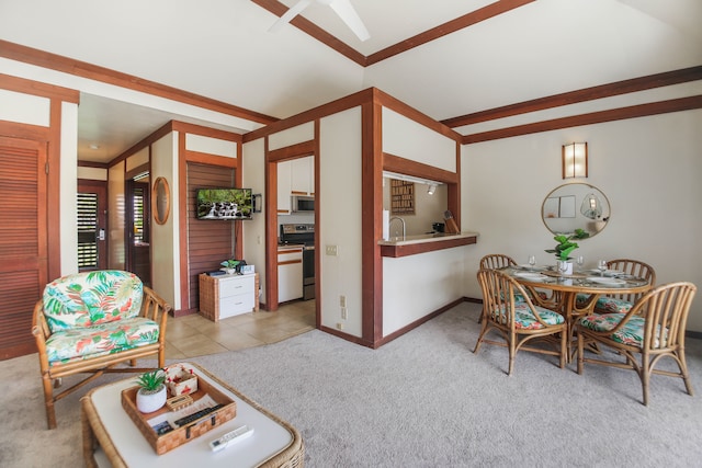 2253 Poipu Rd Unit 148, Koloa, HI 96756 - living area with light carpet, lofted ceiling, a ceiling fan, and baseboards