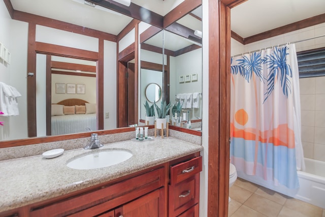 2253 Poipu Rd Unit 148, Koloa, HI 96756 - bathroom featuring vanity, tile patterned floors, toilet, and shower / bath combo with shower curtain