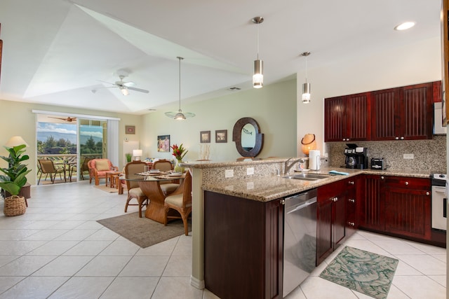 69-200 Pohakulana Pl Unit A31, Waikoloa, HI 96738 - kitchen with appliances with stainless steel finishes, dark brown cabinets, light tile patterned flooring, a peninsula, and vaulted ceiling