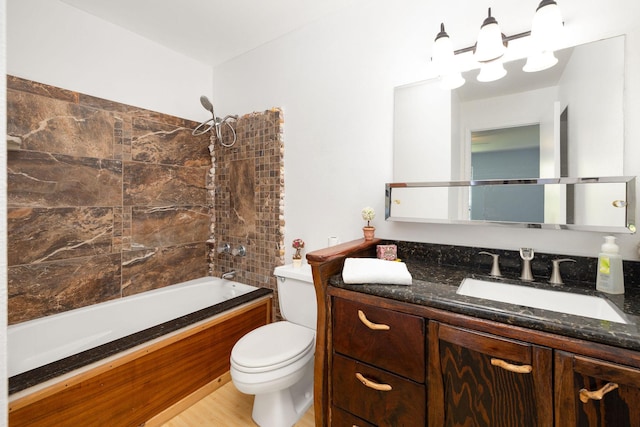bathroom featuring vanity, toilet, wood finished floors, and tub / shower combination