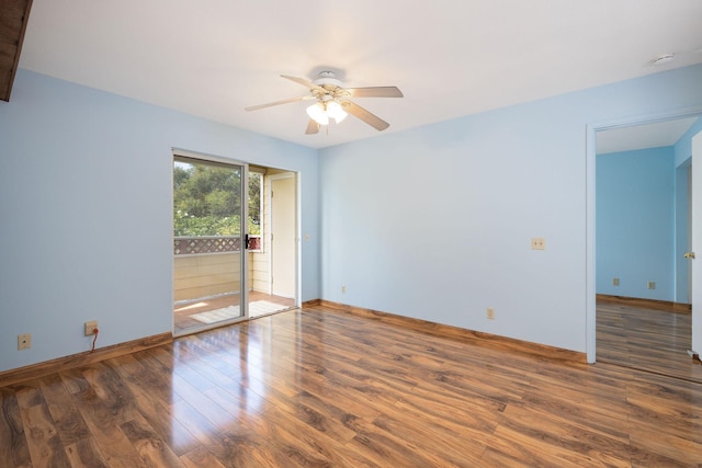 unfurnished room with baseboards, a ceiling fan, and wood finished floors