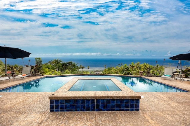 pool with a water view, an in ground hot tub, and a patio