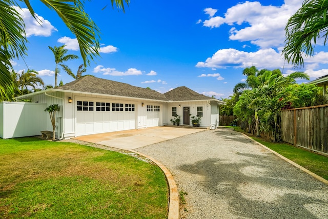 5413 Nakoa St, Koloa, HI 96756 - ranch-style house with gravel driveway, an attached garage, board and batten siding, and roof with shingles