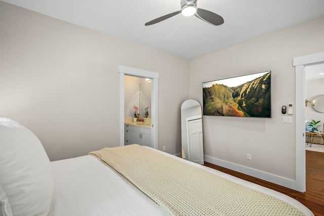 5413 Nakoa St, Koloa, HI 96756 - bedroom featuring wood finished floors, baseboards, connected bathroom, and ceiling fan