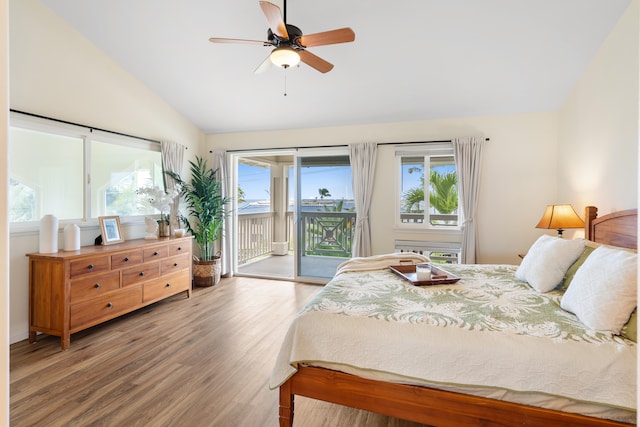 bedroom featuring lofted ceiling, access to outside, wood finished floors, and a ceiling fan