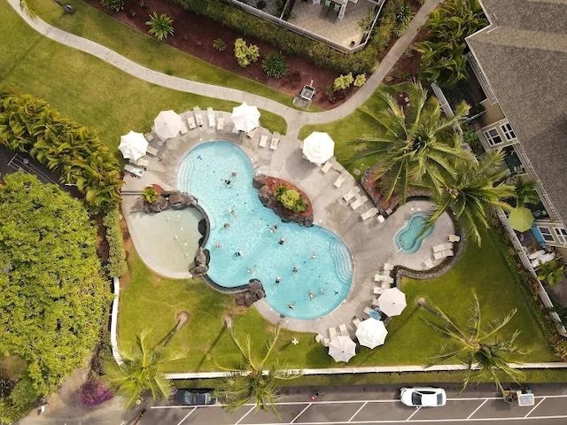 view of property location with a pool area