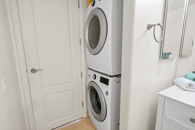 laundry area featuring stacked washing machine and dryer