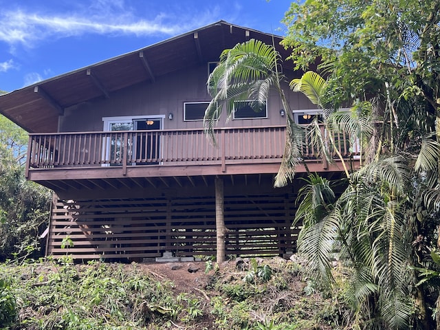 back of house with a wooden deck