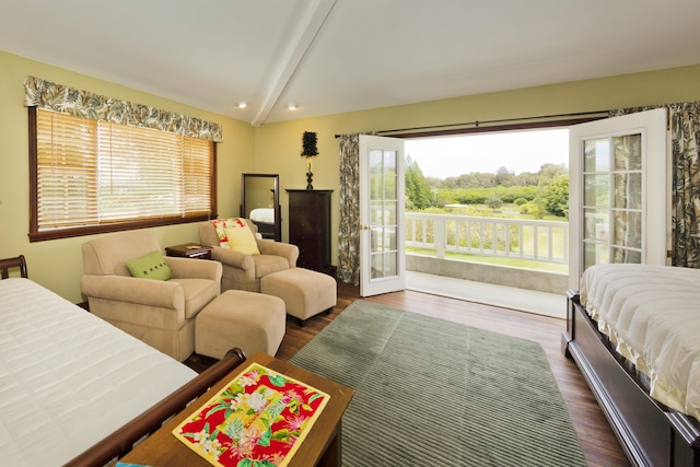 bedroom featuring access to outside, lofted ceiling with beams, and dark wood finished floors