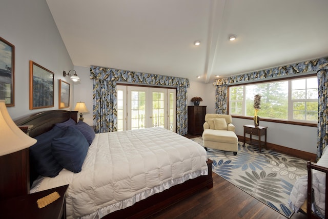 bedroom with wood finished floors, lofted ceiling, multiple windows, and access to exterior
