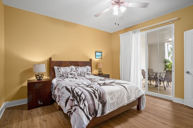 4771 Pepelani Lp Unit 411, Princeville, HI 96722 - bedroom featuring wood finished floors, access to exterior, a ceiling fan, and baseboards