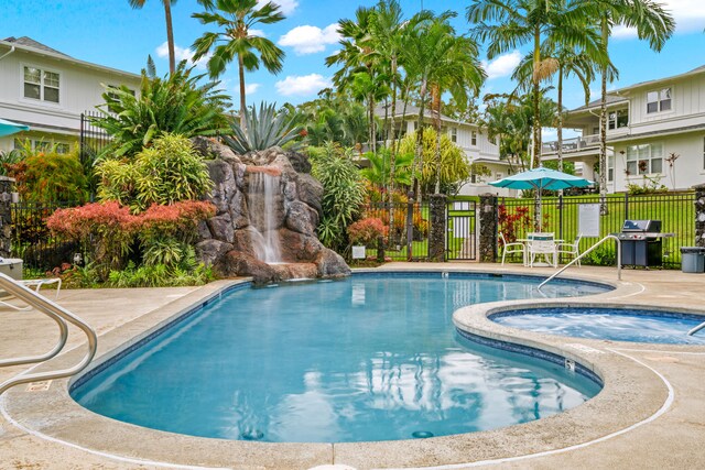 4771 Pepelani Lp Unit 411, Princeville, HI 96722 - pool featuring grilling area, fence, and a patio