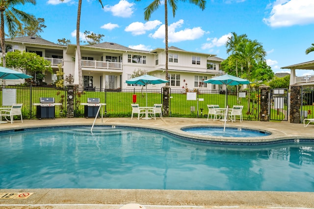 4771 Pepelani Lp Unit 411, Princeville, HI 96722 - pool featuring fence, a community hot tub, and area for grilling