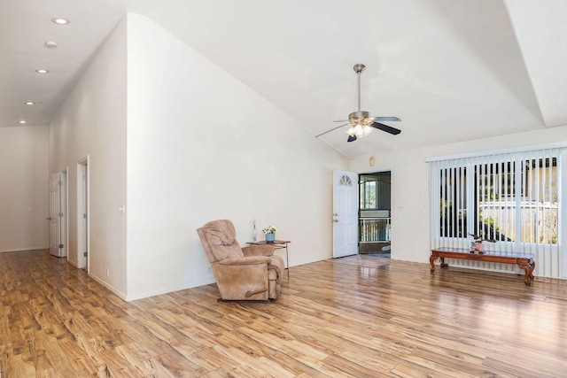 living area with recessed lighting, light wood-type flooring, ceiling fan, and high vaulted ceiling