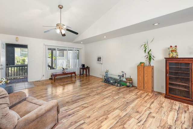 living room with a ceiling fan, recessed lighting, light wood-type flooring, and vaulted ceiling