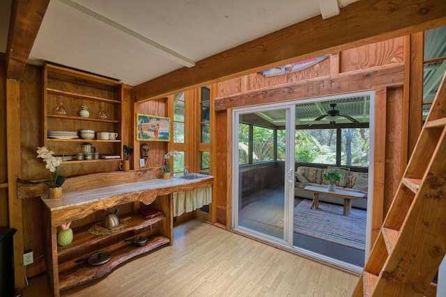 office with wood finished floors and beam ceiling
