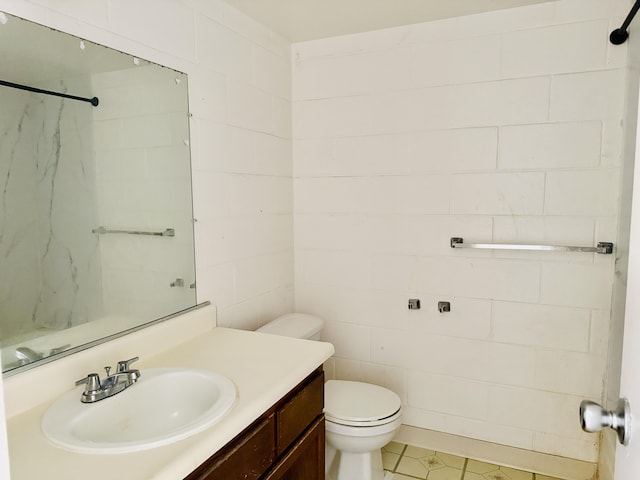 full bath with vanity, walk in shower, and toilet