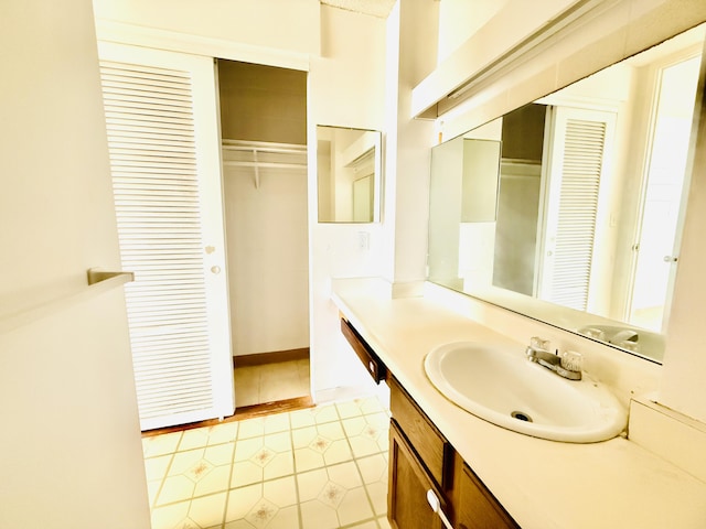 bathroom featuring vanity and tile patterned flooring