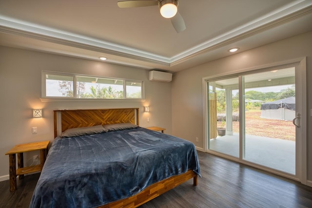 bedroom featuring a wall unit AC, access to exterior, baseboards, recessed lighting, and wood finished floors