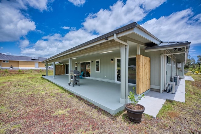 back of house featuring a patio and ac unit