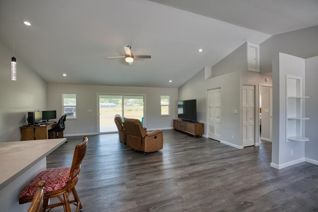 living room with ceiling fan, baseboards, and plenty of natural light
