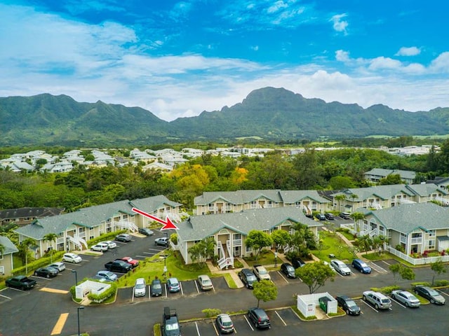 aerial view of residential area featuring mountains
