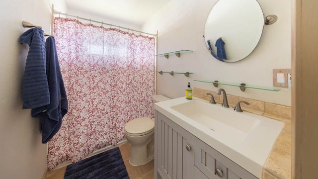 full bathroom featuring toilet, vanity, and a shower with shower curtain