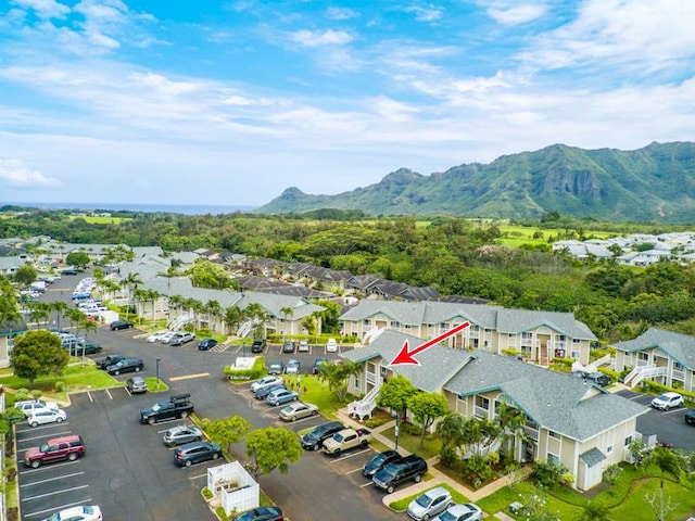 aerial view of residential area featuring mountains