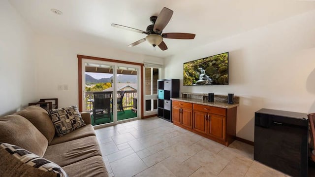 living area with a ceiling fan