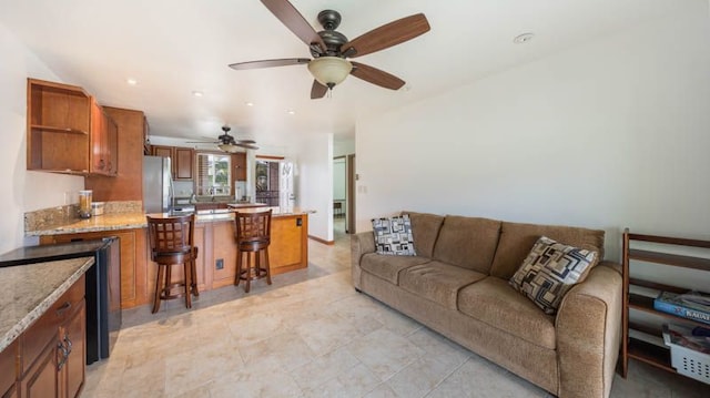 living room with a ceiling fan