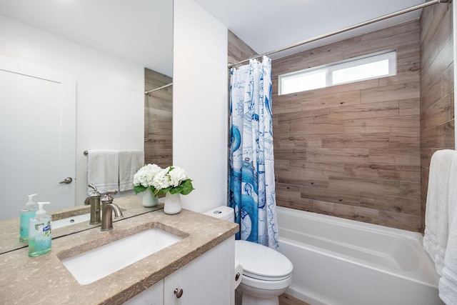 bathroom with toilet, shower / bath combo, and vanity