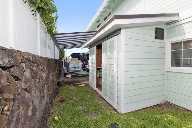 view of side of home with a carport