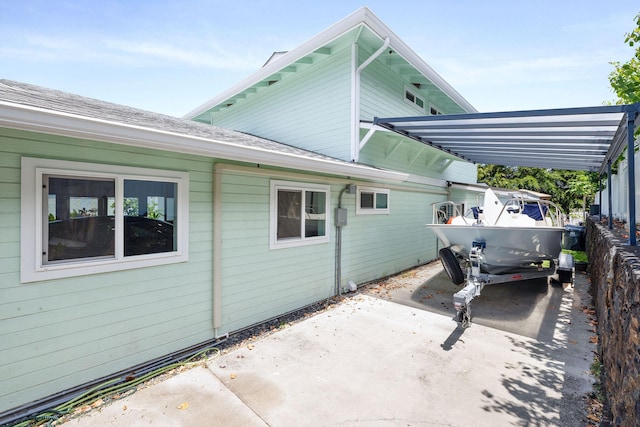 view of property exterior with driveway
