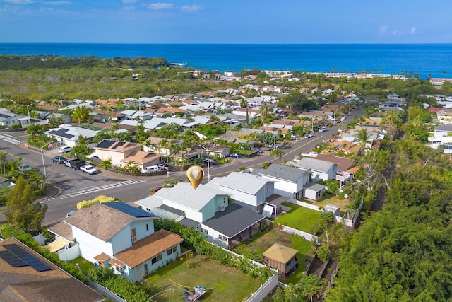 birds eye view of property with a water view and a residential view