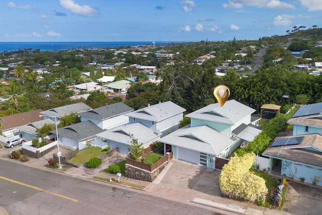 birds eye view of property with a residential view and a water view