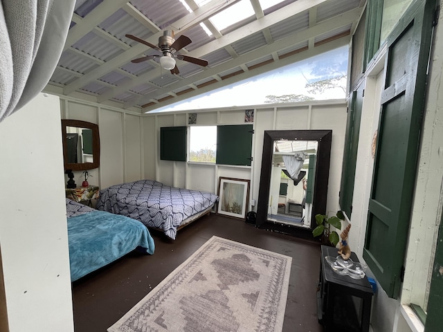 bedroom featuring vaulted ceiling and concrete floors