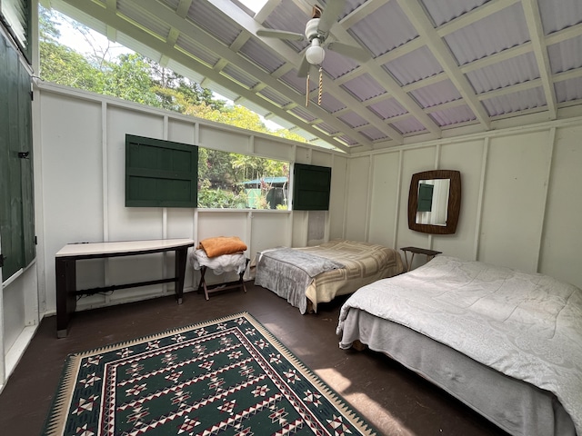 bedroom with vaulted ceiling and a decorative wall