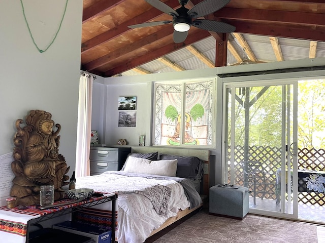 bedroom with lofted ceiling with beams and access to exterior