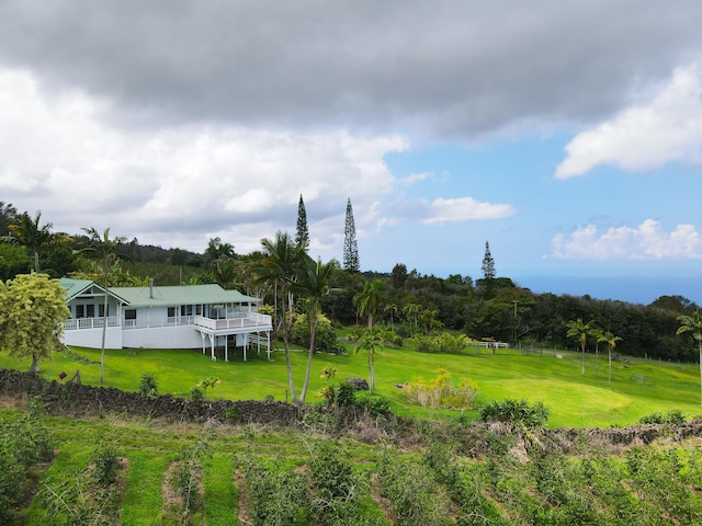 view of grassy yard featuring a wooden deck