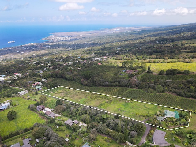 overview of rural landscape featuring rows of crops, property boundaries highlighted, and a nearby body of water