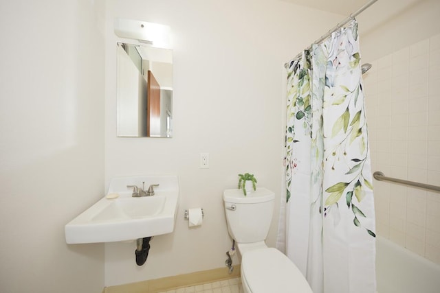 full bathroom with a sink, toilet, and shower / bath combo