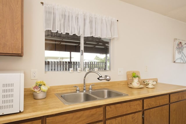 kitchen with a sink and light countertops