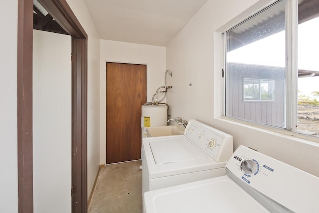 laundry area with separate washer and dryer and water heater