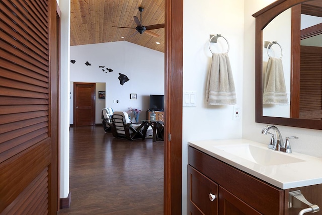 bathroom with ceiling fan, vanity, high vaulted ceiling, wood finished floors, and wood ceiling