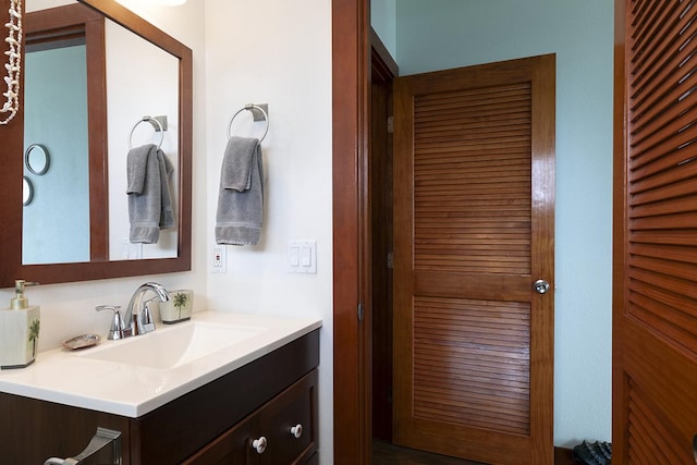 bathroom featuring a closet and vanity