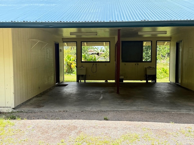 exterior space featuring metal roof and a carport