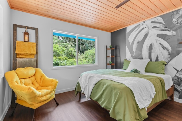 bedroom with wood ceiling, wood finished floors, and baseboards