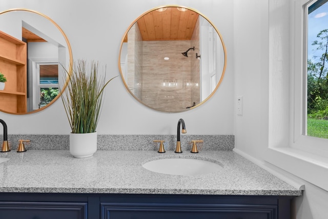 bathroom with vanity and wooden ceiling