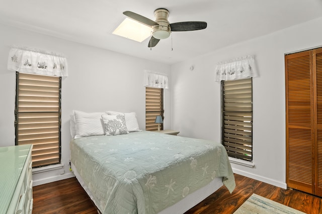 5366 Kumole St, Kapaa, HI 96746 - bedroom with a closet, wood finished floors, baseboards, ceiling fan, and a skylight