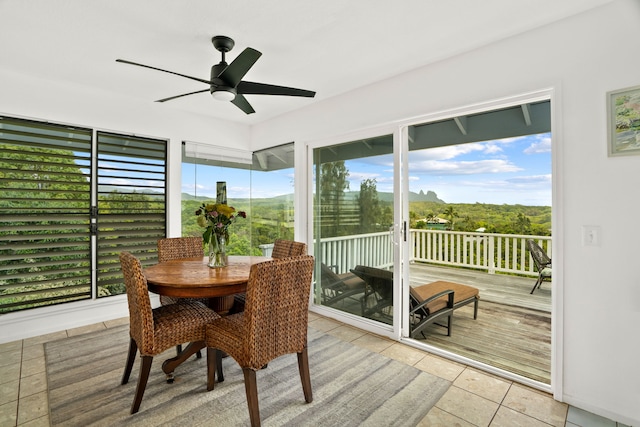 5366 Kumole St, Kapaa, HI 96746 - sunroom / solarium with tile patterned floors, ceiling fan, a wooden deck, and outdoor dining space